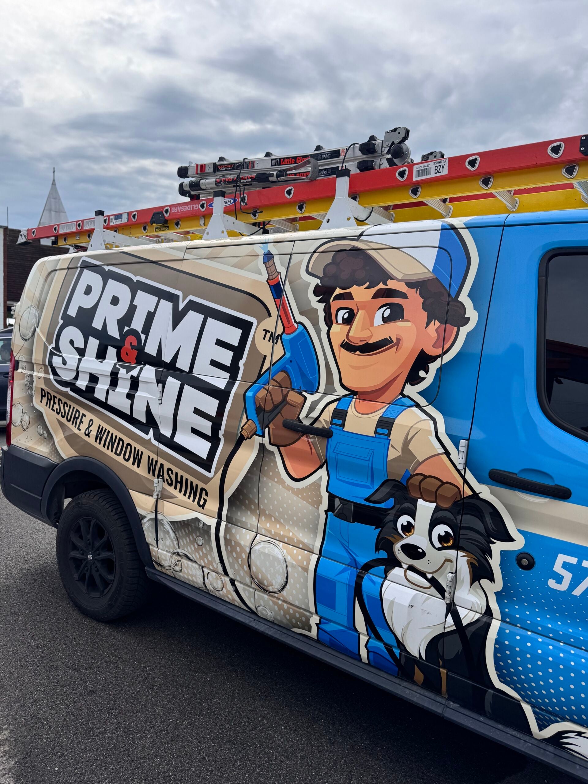 Prime & Shine Pressure & Window Washing service van with a cartoon mascot and border collie on the full vehicle wrap